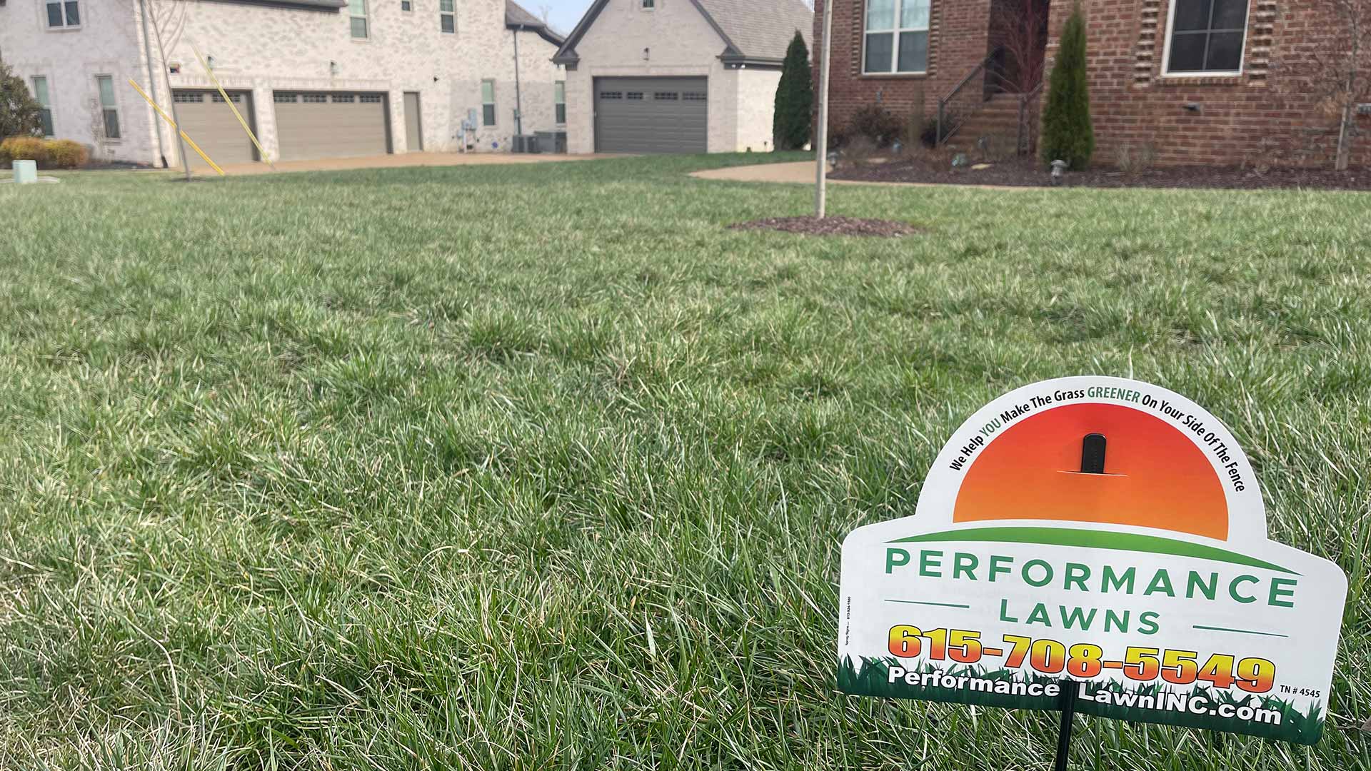 Branded signage displayed on a serviced lawn in Gallatin, TN.